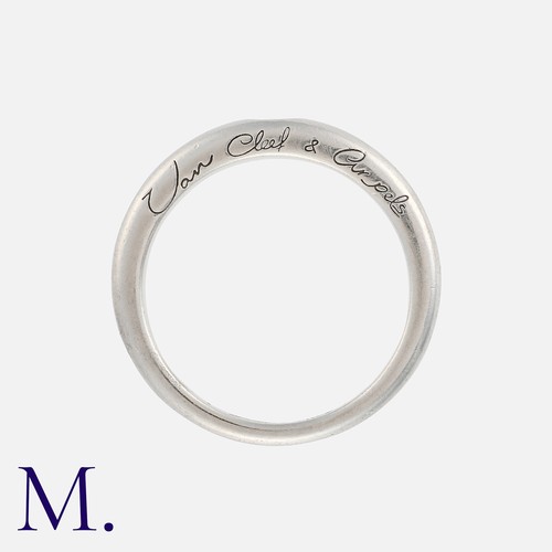 132 - VAN CLEEF & ARPELS. A Diamond Band in platinum, set with a round brilliant cut diamond accent to a p... 