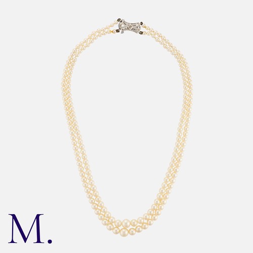 171 - A Pearl Necklace, comprising two rows of graduated pearls measuring approximately 3.2 - 7.3mm, termi... 