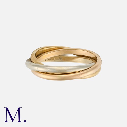 97 - HERMES. A Trinity Ring in 18K yellow, rose and white gold.  Signed Hermes Paris and French marks for... 