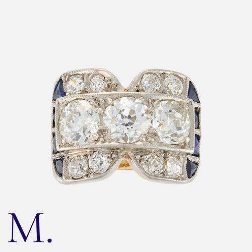 160 - An Old Cut Diamond Cocktail Ring in yellow gold, set with three principal old cut diamonds totalling... 