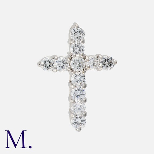 134 - A Diamond Crucifix Pendant in 18 carat white gold, set with eleven round brilliant cut diamonds tota... 