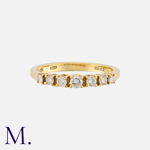 174 - A Diamond Seven Stone Ring in 18 carat gold, set with seven round cut diamonds totalling approximate... 