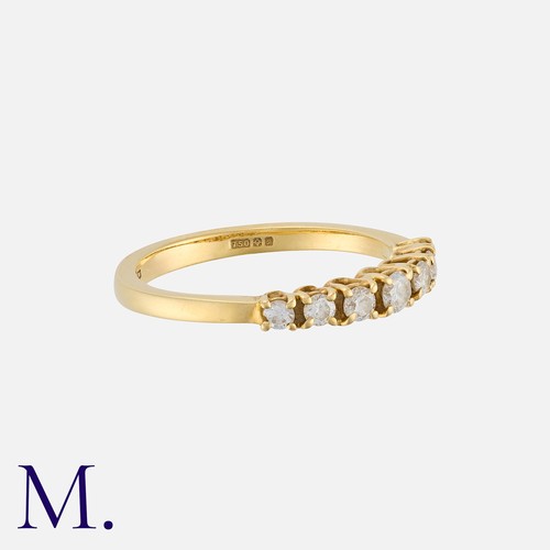 174 - A Diamond Seven Stone Ring in 18 carat gold, set with seven round cut diamonds totalling approximate... 