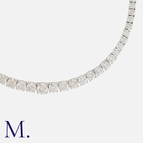 110 - A 17.25ct Diamond Line Necklace in white gold, set with 125 round brilliant cut diamonds weighing a ... 