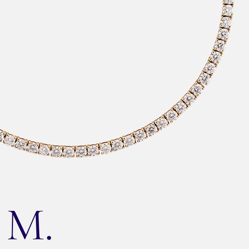 136 - An 18.50 Carat Diamond Line Necklace. in 18 carat rose gold, set with a row of interlocking links, e... 