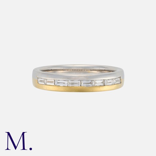 140 - A Diamond Band Ring in 18 carat white and yellow gold, set with a row of eight baguette cut diamonds... 