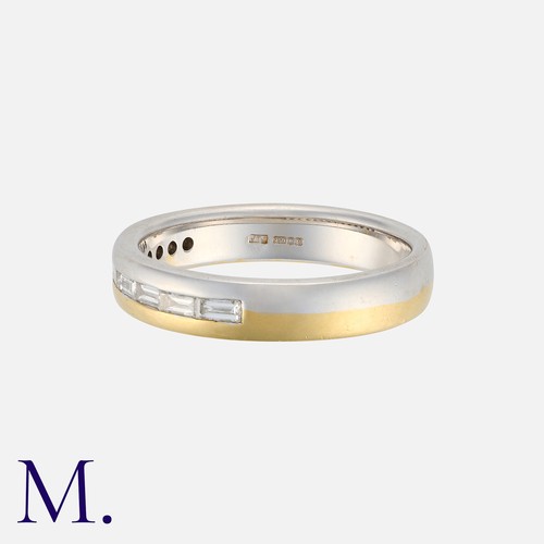 140 - A Diamond Band Ring in 18 carat white and yellow gold, set with a row of eight baguette cut diamonds... 