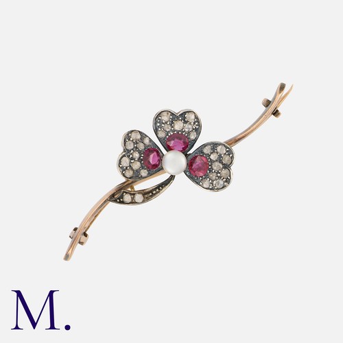 154 - An Antique Shamrock Brooch in rose gold and silver, set with a pearl, spinels and diamonds.  Unmarke... 