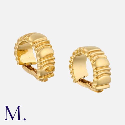 129 - CARTIER. A Pair of Baignoire Hoop Earclips in 18K yellow gold, signed Cartier and serial numbered.  ... 