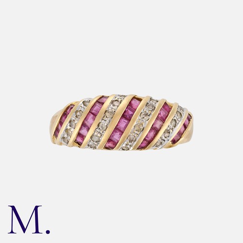 259 - A Ruby and Diamond Ring in yellow gold set with round cut diamonds weighing approx. 0.10ct and calib... 