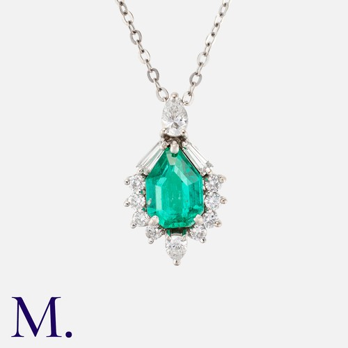 178 - A Colombian Emerald & Diamond Pendant in 18k white gold, set with a principal mixed cut emerald with... 
