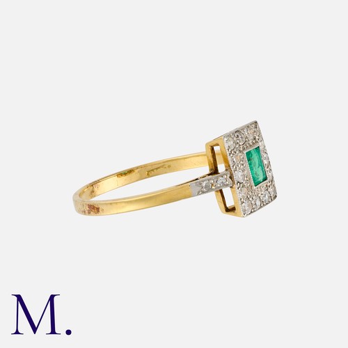 9 - An Emerald and Diamond Cluster Ring in yellow gold and platinum, set with a central step cut emerald... 