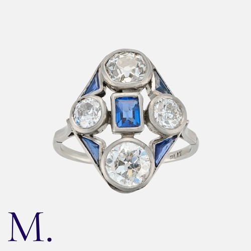102 - An Art Deco Sapphire and Old Cut Diamond Ring in platinum, set with a central step cut sapphire acce... 