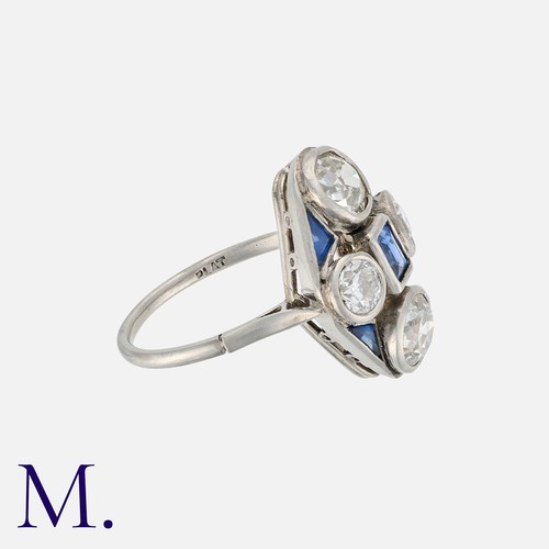 102 - An Art Deco Sapphire and Old Cut Diamond Ring in platinum, set with a central step cut sapphire acce... 