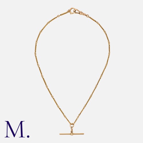 114 - A Gold Chain with T-Bar in 9ct rose gold, the chain, lobster clasp and T-bar each stamped '9c' and t... 