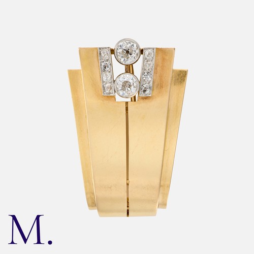 97 - A Retro Diamond Clip Brooch in yellow gold, set with two principal old cut diamonds totalling approx... 