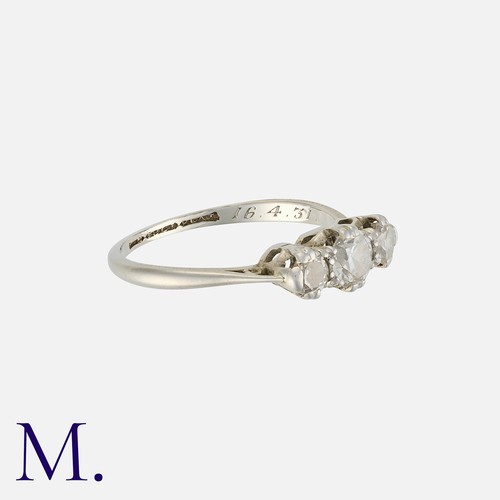 88 - A Diamond Three Stone Ring in 18 carat gold and platinum, set with three round cut diamonds totallin... 