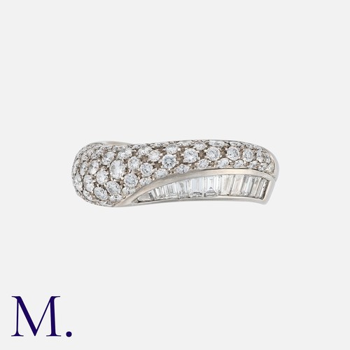 70 - BOUCHERON. A Diamond Band in 18K white gold, set with round-cut and baguette-cut diamonds weighing a... 