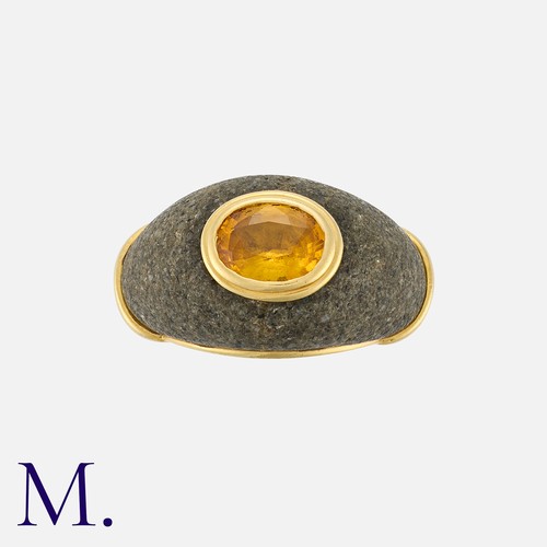 120 - CARTIER. A Citrine and Hardstone Ring in 18K yellow gold, bezel set with an oval cut citrine inset t... 