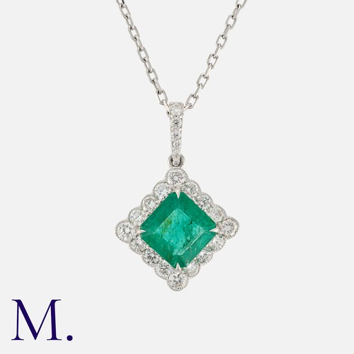 91 - An Emerald and Diamond Pendant Necklace in 18 carat white gold, comprising an octagonal step cut eme... 