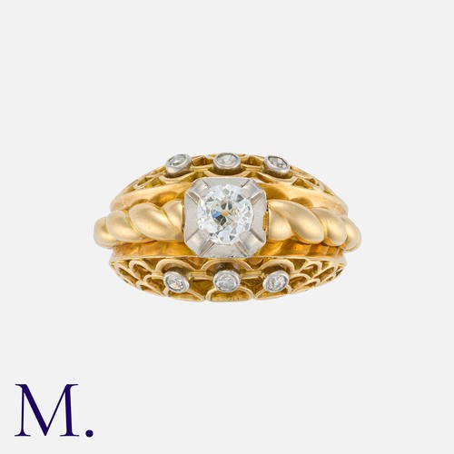 100 - A Retro Old Cut Diamond Bombé Ring in yellow gold, the openwork form set with a principal old cut di... 