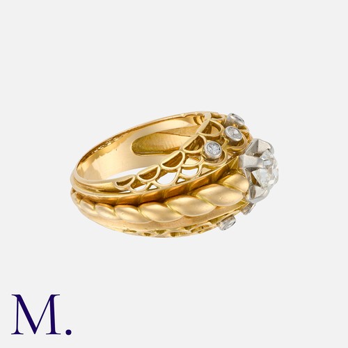 100 - A Retro Old Cut Diamond Bombé Ring in yellow gold, the openwork form set with a principal old cut di... 