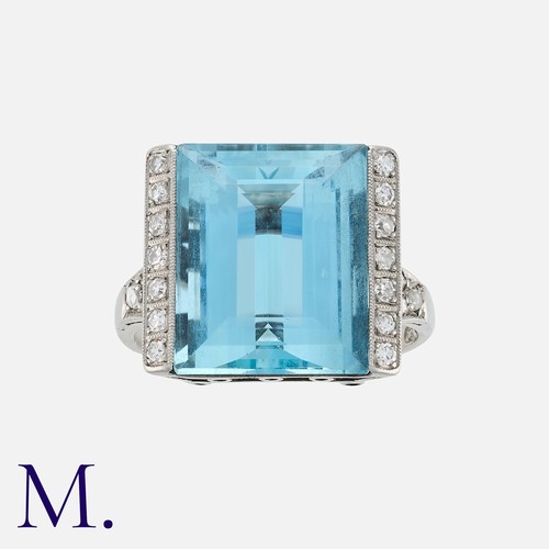 76 - An Aquamarine and Diamond Ring in white gold, set with a step cut aquamarine of approximately 10.0 c... 