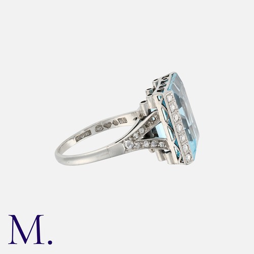 76 - An Aquamarine and Diamond Ring in white gold, set with a step cut aquamarine of approximately 10.0 c... 