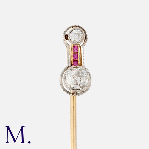 78 - An Art Deco Ruby and Diamond Stick Pin in yellow gold and platinum, set with two old cut diamonds to... 