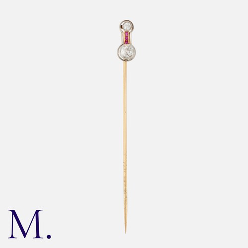 78 - An Art Deco Ruby and Diamond Stick Pin in yellow gold and platinum, set with two old cut diamonds to... 