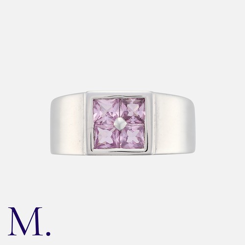 80 - HERMÈS. A Pink Sapphire 'Orion' Ring in 18K white gold, set with four princess cut sapphires to a sq... 