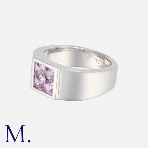 80 - HERMÈS. A Pink Sapphire 'Orion' Ring in 18K white gold, set with four princess cut sapphires to a sq... 