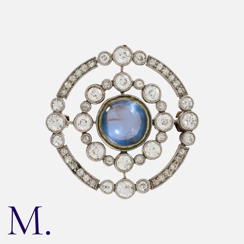 77 - An Art Deco Sapphire and Diamond Brooch in platinum and yellow gold, set with a central cabochon sap... 