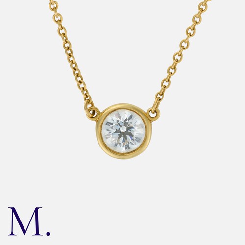 81 - TIFFANY & Co., A Diamond by the Yard Pendant & Chain in 18K yellow gold, set with a round brilliant ... 