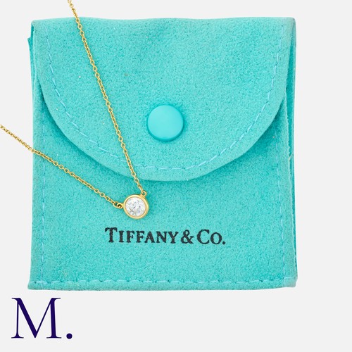 81 - TIFFANY & Co., A Diamond by the Yard Pendant & Chain in 18K yellow gold, set with a round brilliant ... 