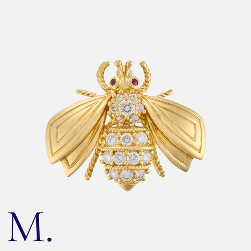 82 - TIFFANY & Co., A Diamond and Ruby Bee Brooch, in 18k yellow gold, designed as a bee, the body set wi... 