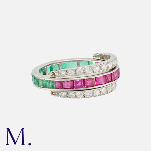 110 - A Reversible Ruby, Emerald And Diamond Ring in white gold, set to one side with a row of calibre cut... 