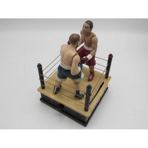 4 - Cast iron articulated money box