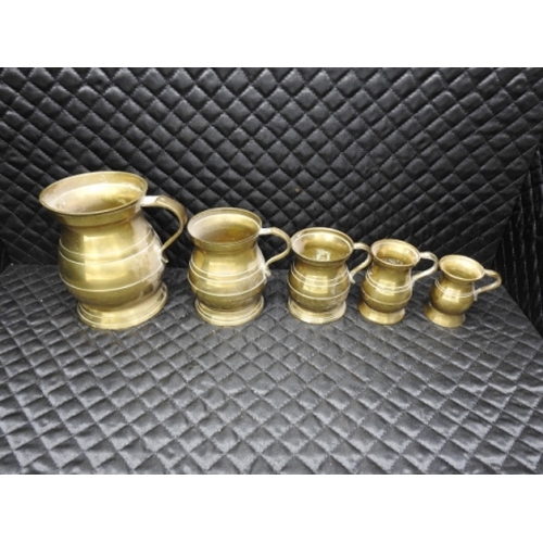 7 - Graduated brass mugs