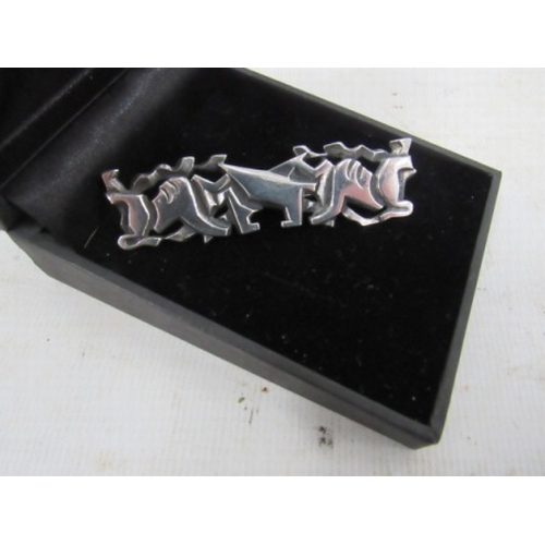 354 - Silver abstract Lions brooch