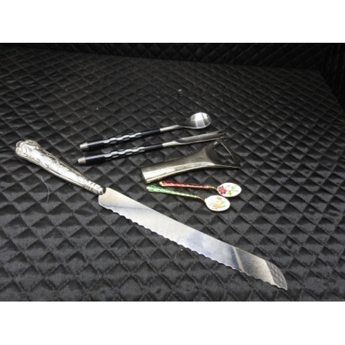 264 - 2 spoons, fork and spoon, silver handled bread knife and a bottle opener.