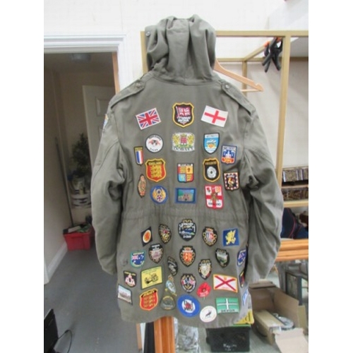 91 - Ex Army parka with approx 85 patches