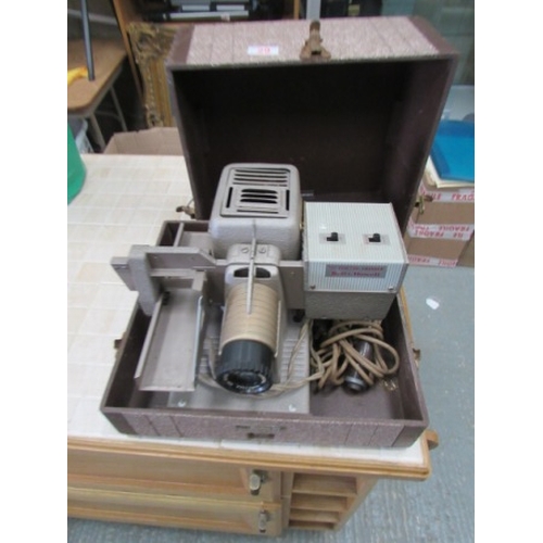 29 - Cased Bell and Howell slide projector
