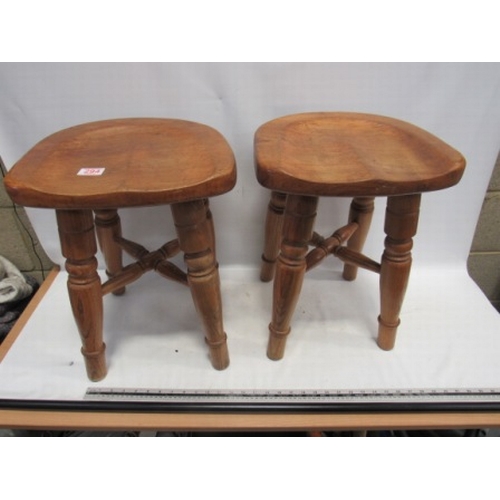 294 - pair of saddle seated Ash stools