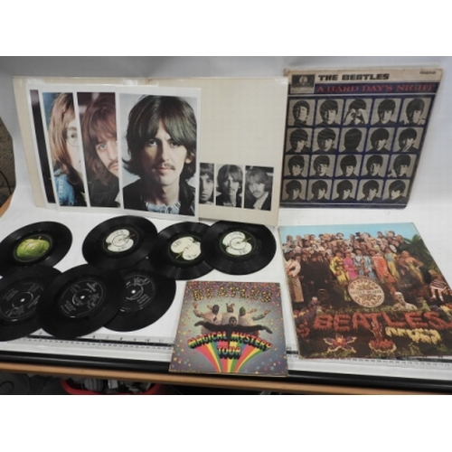 215 - Beatles records. 4 lps and 7 singles