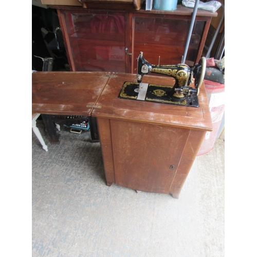 82 - Fisher Rossman sewing Machine