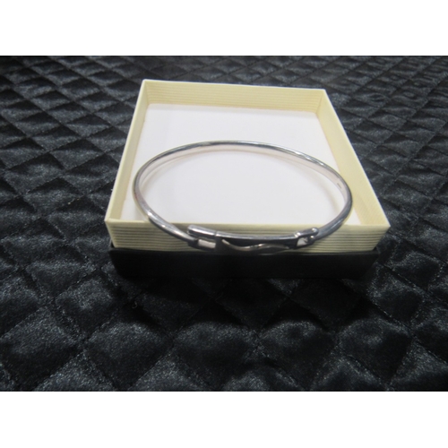 116 - Silver bangle with diamond stone