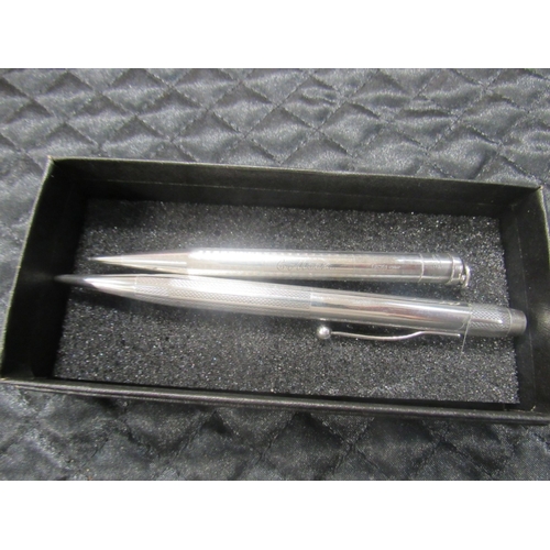 119 - 2 Silver propelling pencils