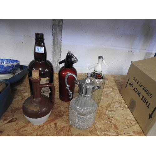 81 - Selection of soda syphons, claret jug + bottle + bardinet jug