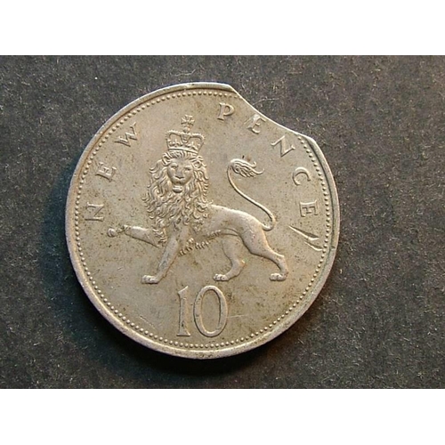 371 - Ten Pence.  1968, VF, dirty, small scratches.  Minting error; small flan clip.